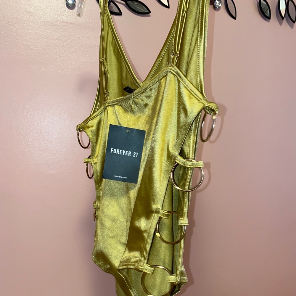 Women’s Gold champagne body suit Gold hoops on side